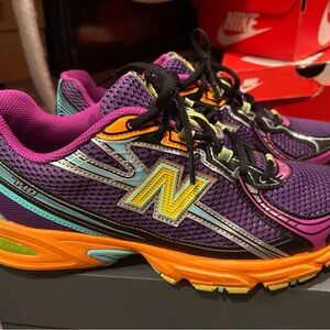 Purple and Orange Unisex New Balance women 10 men 8 1/2